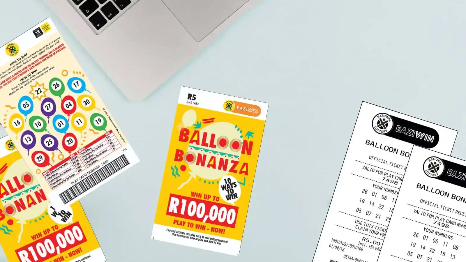 Balloon Bonanza scratch cards and receipts on office light color surface
