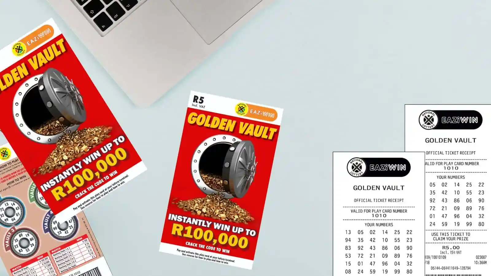 Golden Vault scratch cards and receipts on office light color surface