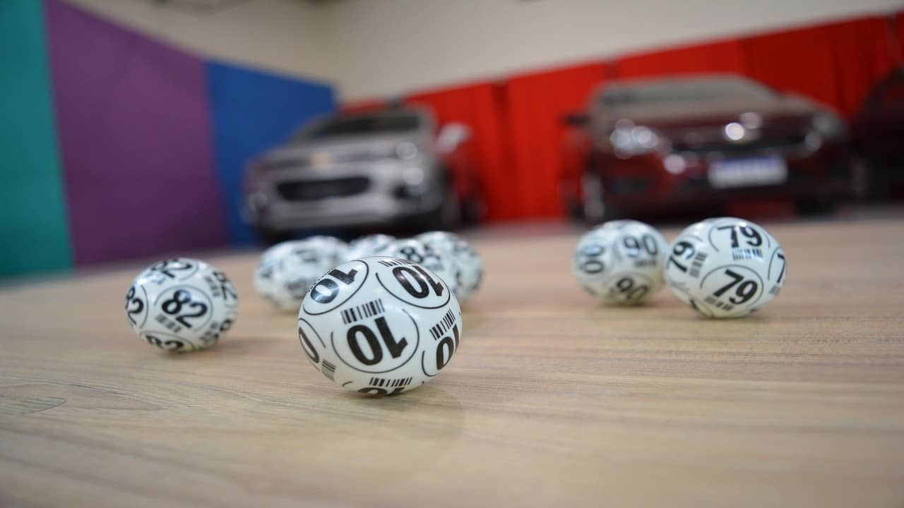 white lotto balls in front of the cars