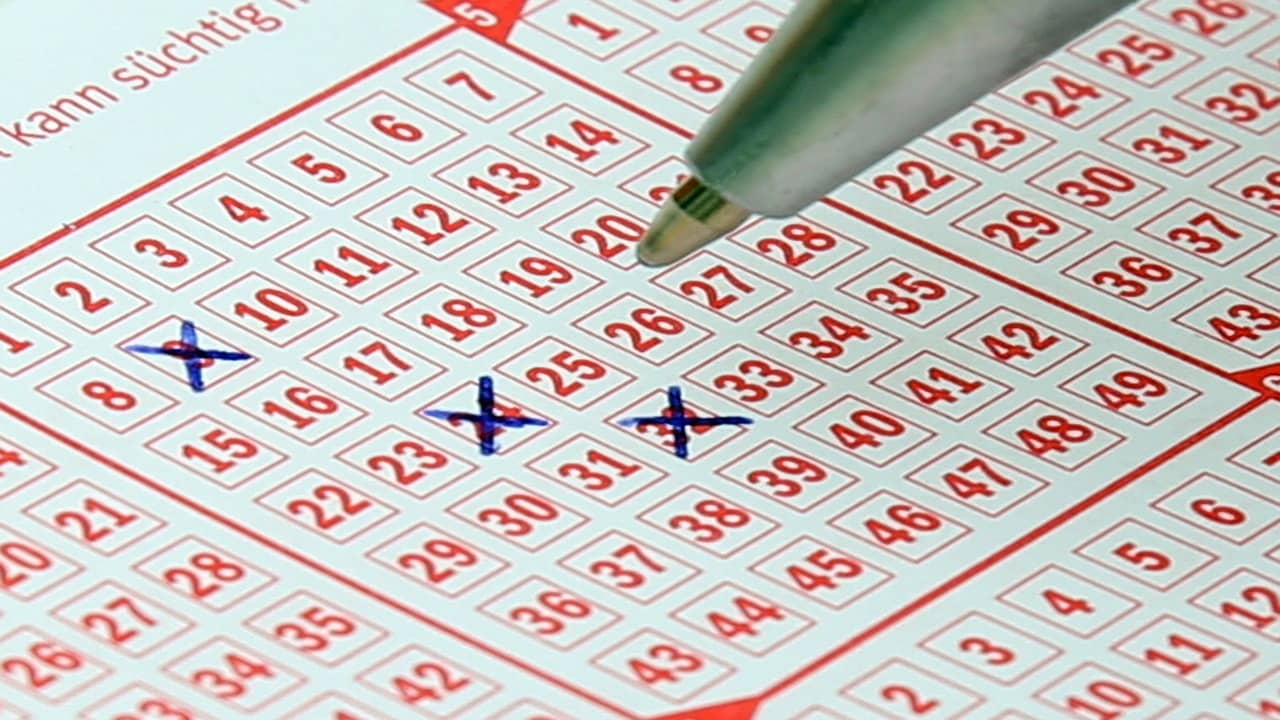 Lotto ticket being filled with pen
