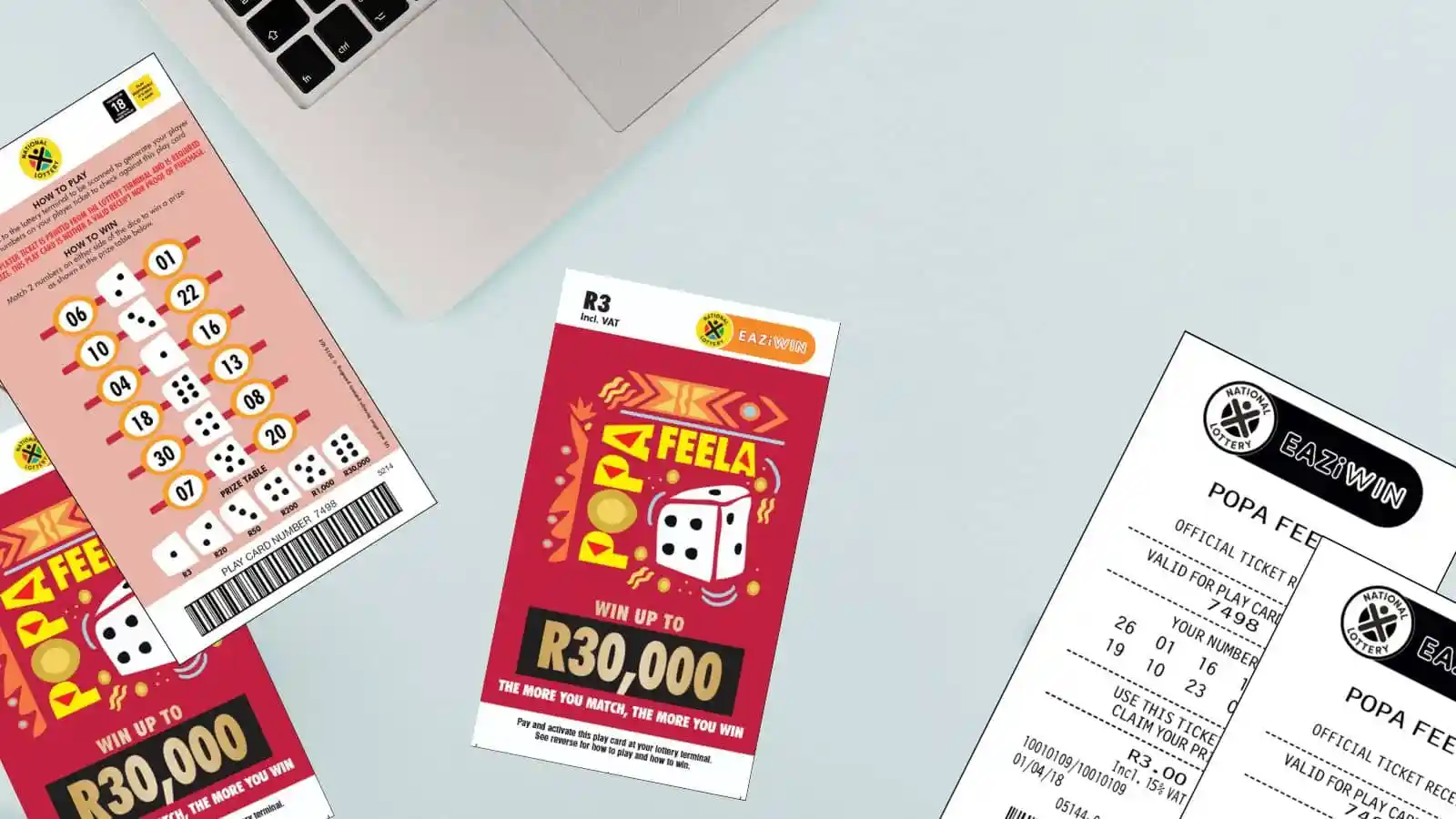 Popa Feela scratch cards and receipts on office light color surface