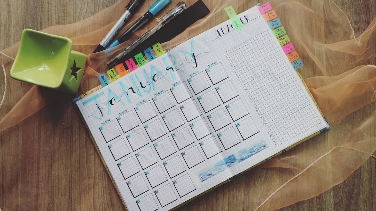 paper notebook with schedule
