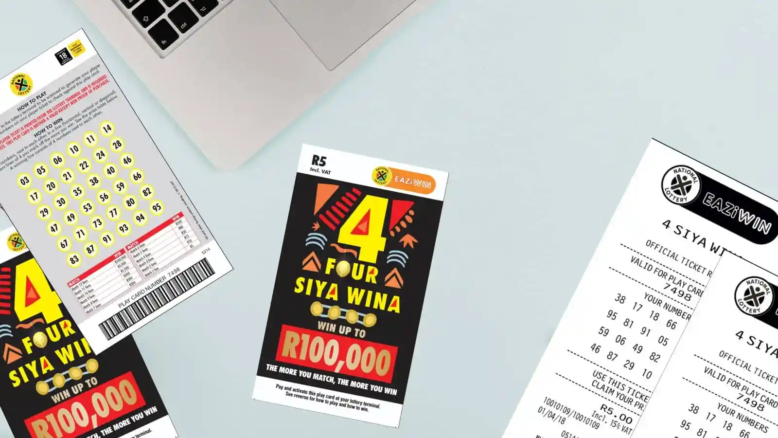 Four Siya Wina scratch cards and receipts on office light color surface