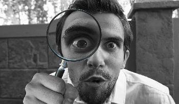 a man with magnifying glass