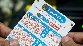 powerball and powerball Xtra ticket in hands