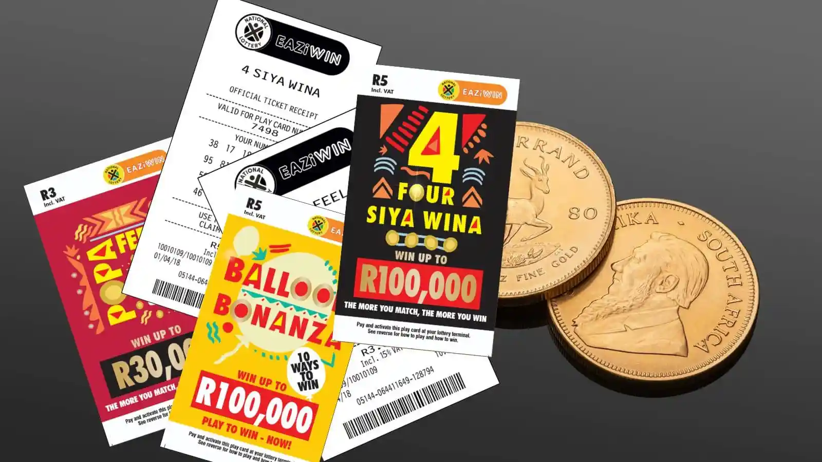 mix of eaziwin sa scratch cards and gold sa krugerrands on black table